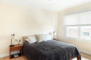 Bedroom featuring baseboards and light wood-style floors