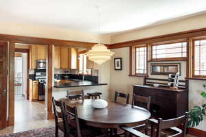 Dining area with light wood finished floors