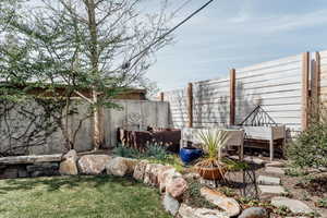Fenced backyard with a wooden deck