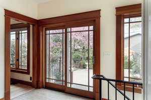 Doorway to outside featuring baseboards