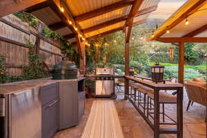 Backyard kitchenette with sink, ice maker and Green Egg cooker