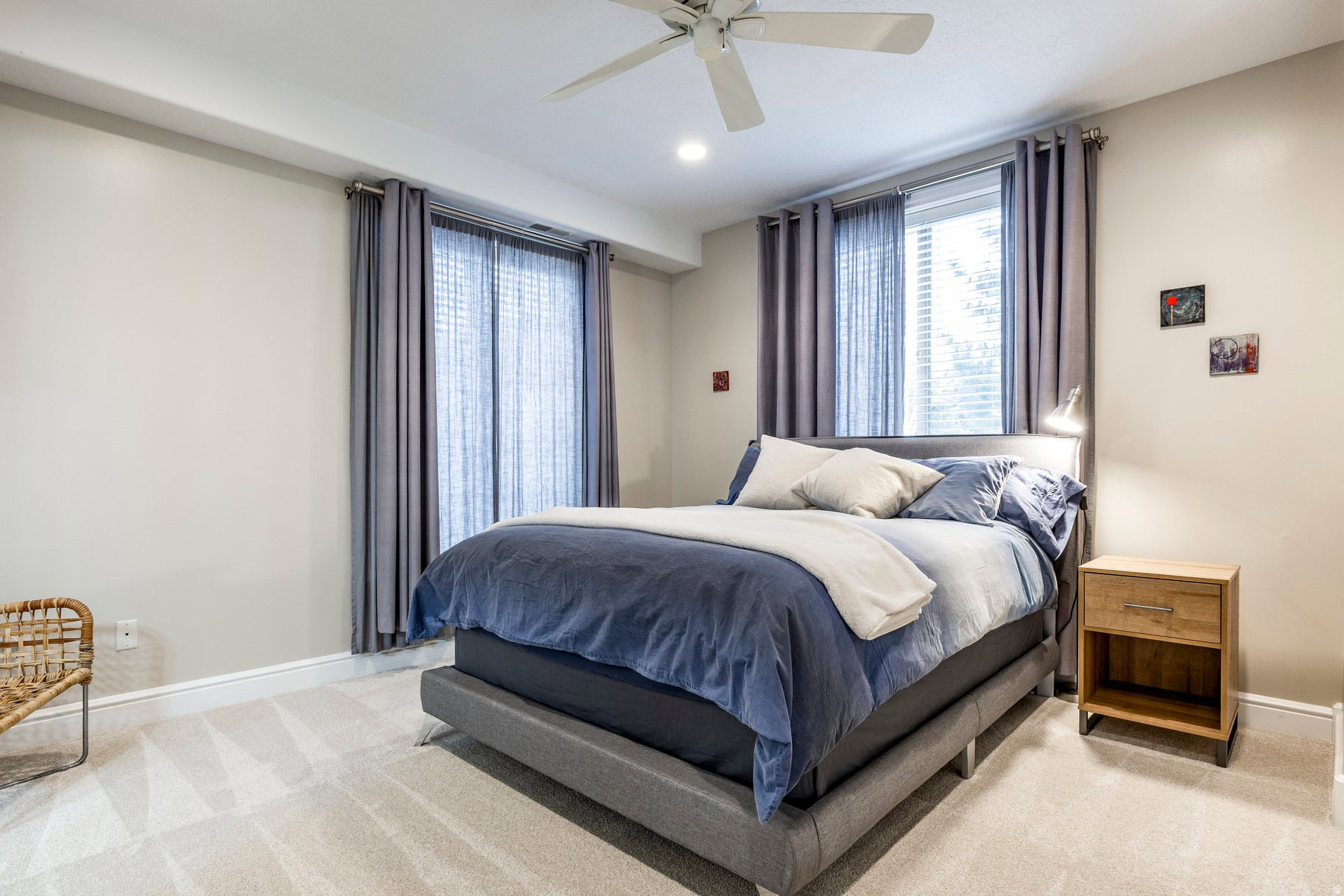Bedroom with light carpet, a ceiling fan, and recessed lighting