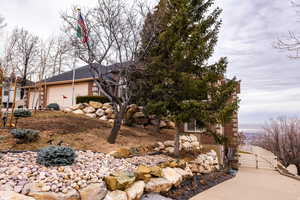 View of front of house with brick siding, a gate, and a garage