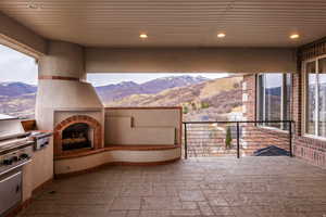 View of patio / terrace with a mountain view and area for grilling