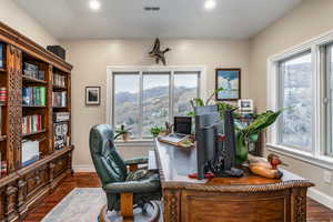Office area featuring dark wood-type flooring, recessed lighting, and a mountain view