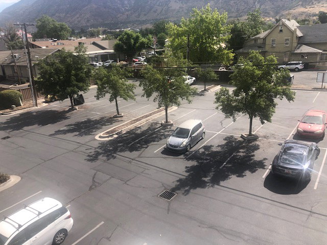 Aerial perspective of suburban area with a mountainous background