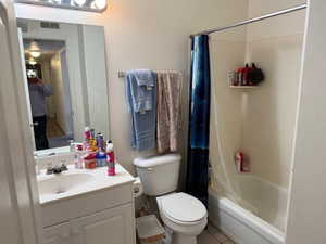 Bathroom featuring vanity and shower / bath combo