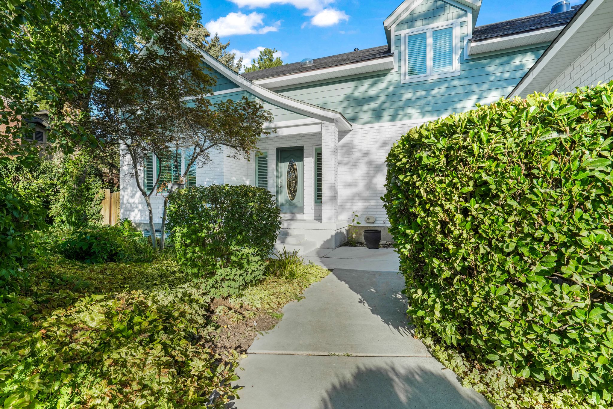 Entrance to property featuring brick siding