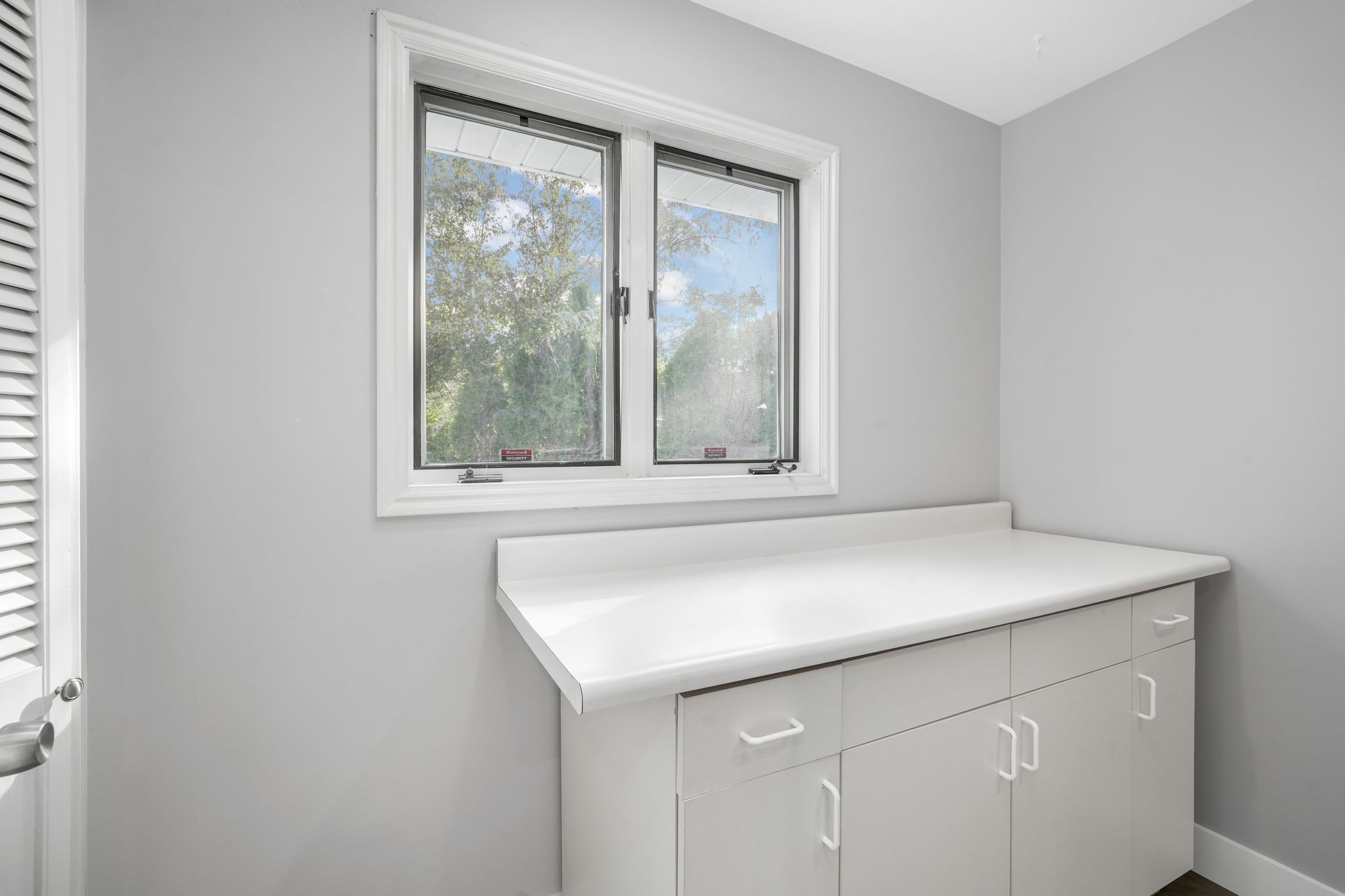 Bathroom featuring vanity and a closet