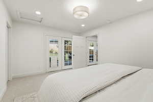 Bedroom featuring access to outside, carpet floors, and recessed lighting