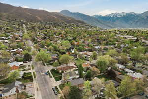 Aerial perspective of suburban area featuring a mountain backdrop