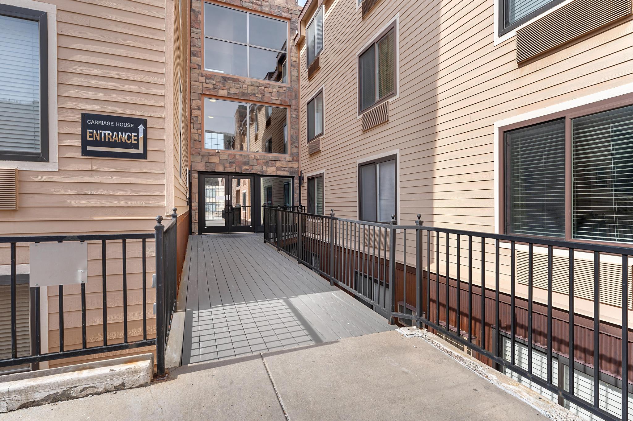 View of wooden balcony featuring a deck