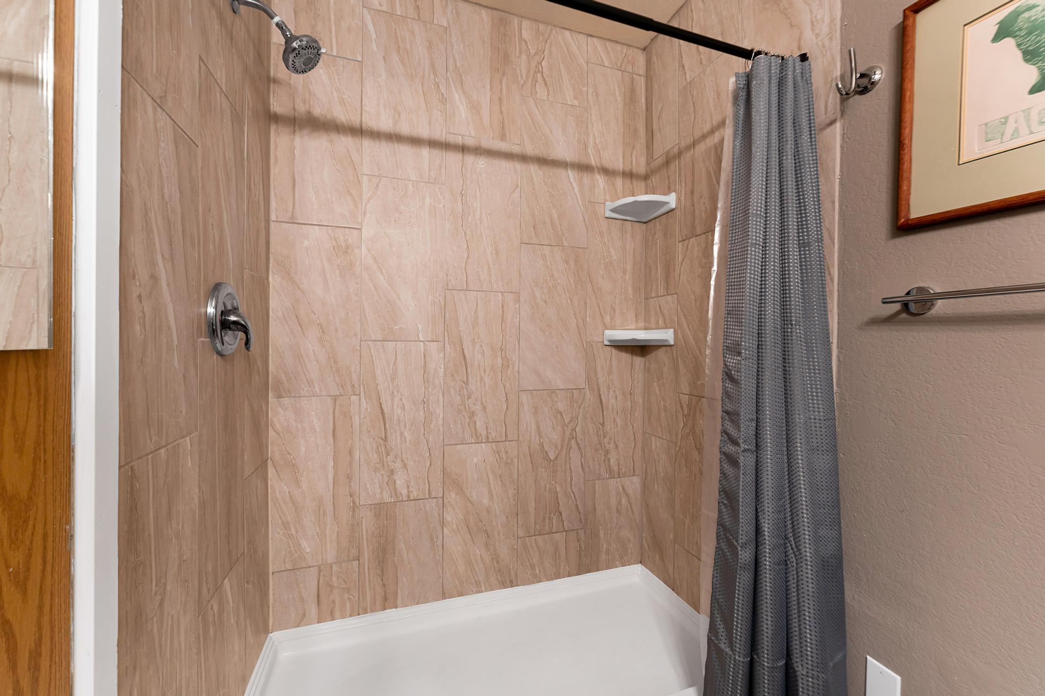 Full bath with a shower stall