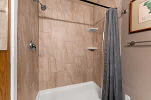 Full bath with a shower stall