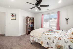 Bedroom with a ceiling fan, carpet, and recessed lighting