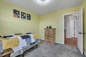 Bedroom with carpet and baseboards