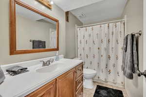 Bathroom featuring vanity and shower / bath combo