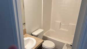 Full bath with vanity,  and washtub / shower combination