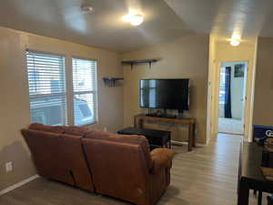Living room with Vaulted ceiling and LVT floors