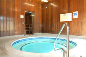 Pool featuring a hot tub