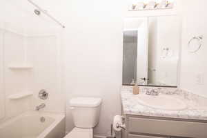 Full bathroom featuring vanity and shower / tub combination