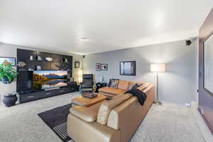 Living room featuring light colored carpet