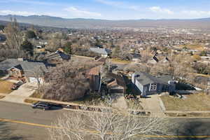 Aerial view of residential area featuring a mountainous background