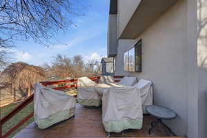 View of wooden balcony featuring a deck