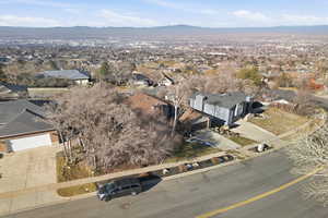Aerial perspective of suburban area with a mountainous background