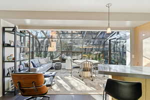 Sunroom featuring an outdoor lounge area with bar