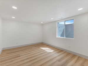 Unfurnished room featuring recessed lighting and light wood-type flooring