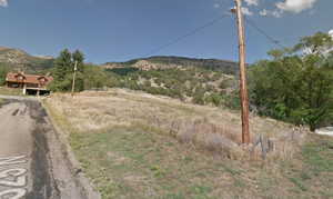 View of mountain backdrop with rural landscape