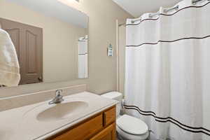 Bathroom with vanity and a shower with curtain