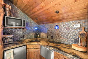 second floor wet bar and kitchen next to open space