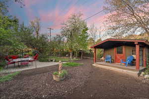 Fenced backyard with an extra built storage