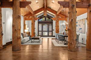 Living room featuring wood-type flooring and hanging lights