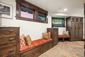 Mudroom featuring stone tile flooring and recessed lighting