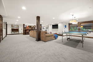 Playroom featuring bar, recessed lighting, and light carpet
