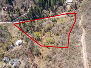 Aerial overview of property's location with property parcel outlined
