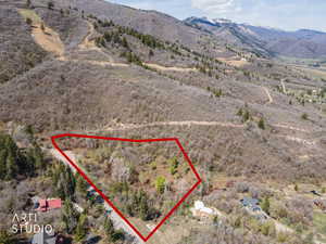 View of rural area featuring property parcel outlined and a mountain backdrop
