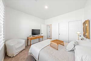 Bedroom with carpet and a closet