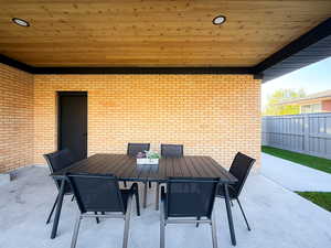 View of patio with outdoor dining area
