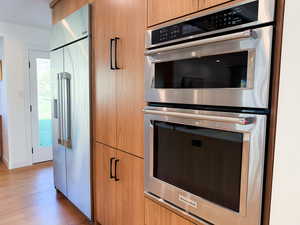 Walnut cabinetry, lots of stainless