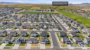 Aerial perspective of suburban area featuring a mountain backdrop