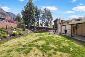 Fenced backyard featuring stairway and a patio