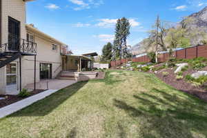Fenced backyard with a patio
