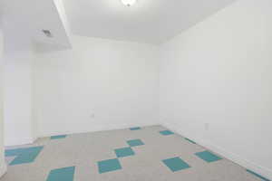 Unfurnished room featuring baseboards