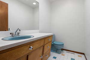 Bathroom featuring vanity and recessed lighting