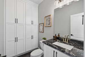 Half bathroom, plumbed for a shower under the cabinets.
