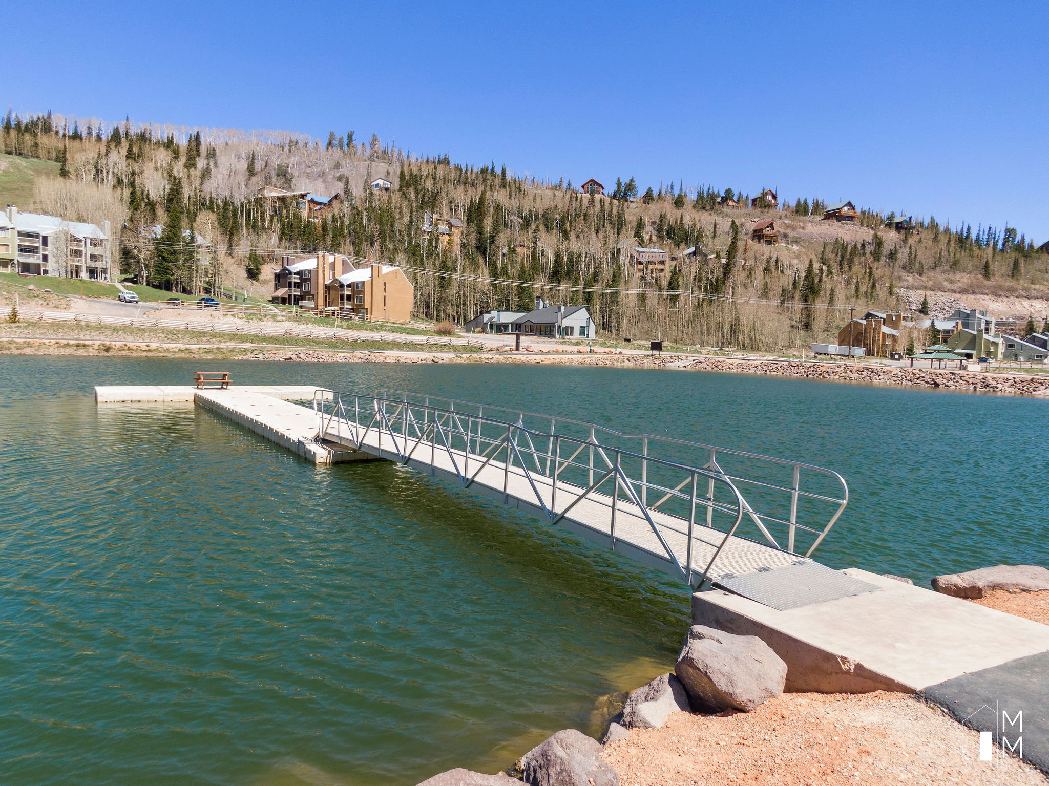 Dock area featuring a water view and a wooded view